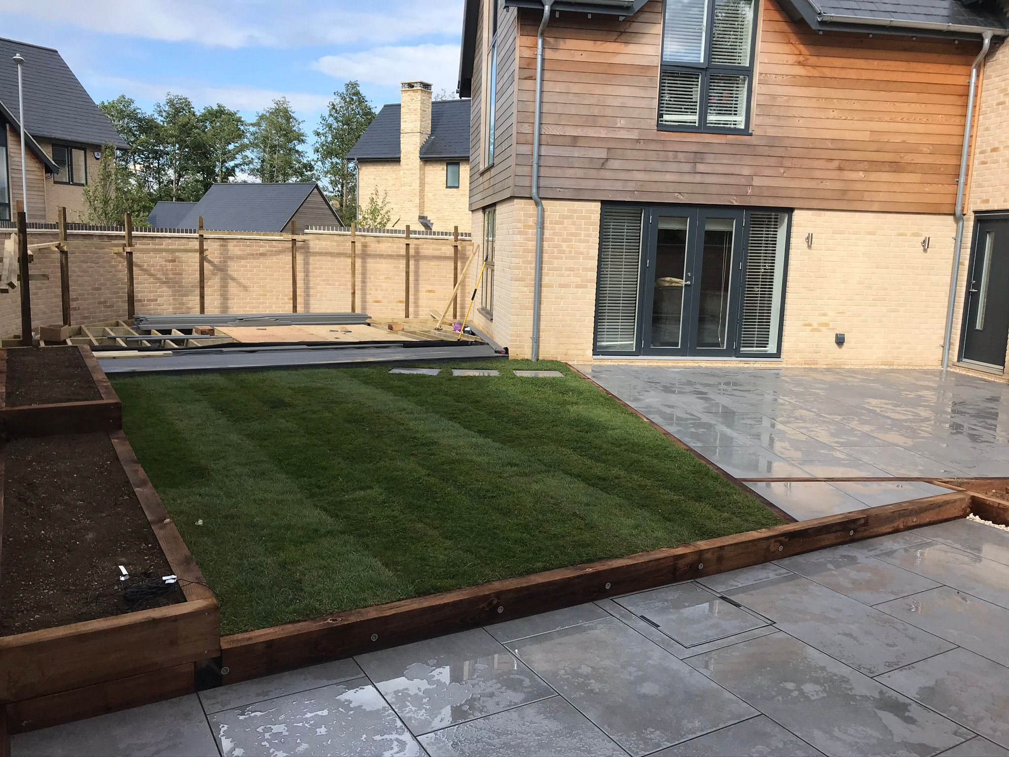 Landscaped courtyard outside a stone home